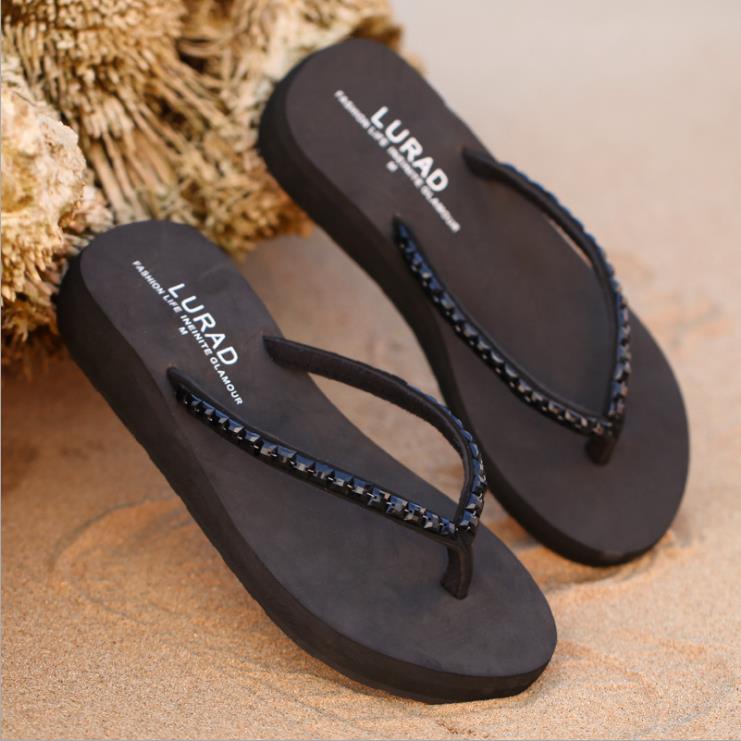 tan and black flip flops